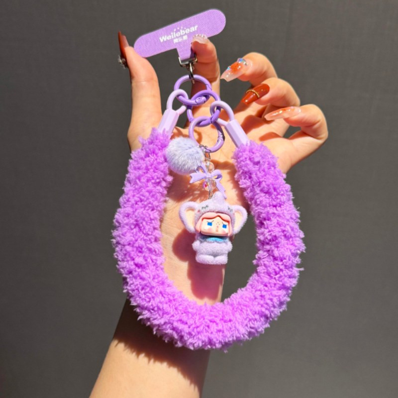 Lanière téléphone poignet ECO moelleuse – Violet, poupée, pompon Lanière téléphone poignet ECO moelleuse – Violet, poupée, pompon