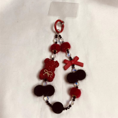Lanière téléphone rouge noir ours pompon | Smarty Paris
