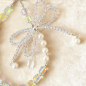 Lanière de téléphone ECO – transparente avec nœud, perles et cristaux blancs Lanière de téléphone ECO – transparente avec nœud, perles et cristaux blancs